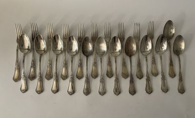 a lot of silver spoons and forks on the table
