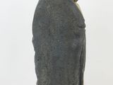 statue of a woman with a bird perched on her head