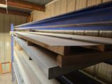 several pieces of wood are stacked on top of each other in a room