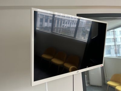 a flat screen tv mounted on a wall in a room