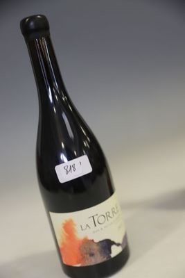 a bottle of wine that is sitting on a table