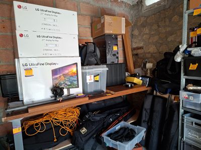 a room with a lot of clutter and a lot of boxes