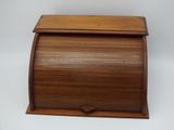 a small wooden box with a lid on a white background
