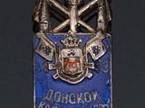 a close up of a badge on a black surface