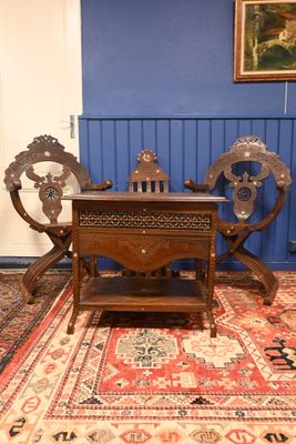 a wooden table and chairs in a room with blue walls