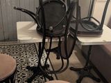 four stools and a table in a room