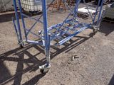 a blue cart that is sitting in the dirt
