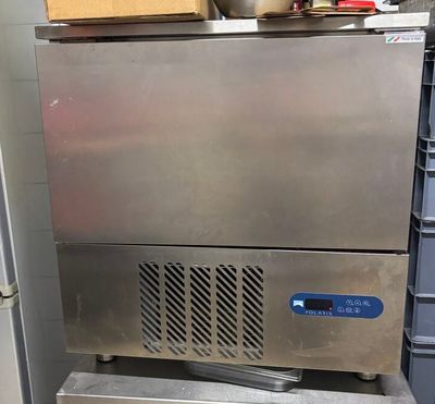 a stainless steel counter with a bowl on top of it