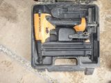 a tool box with a stapler and a stapler in it