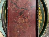 a picture of a plate with a clock and a book on it