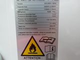 a sign on the back of a refrigerator that says attention