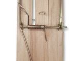 wooden mousetrage with a mousetrage attached to the front of it
