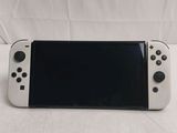 a white nintendo wii game controller with a black screen