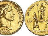 a gold coin with an image of a woman and a man on it