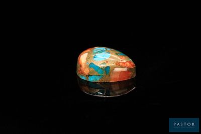 an image of a colorful stone in the dark