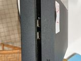 a black video game console sitting on a table