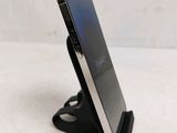 a cell phone that is sitting on a stand