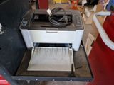 a printer that is sitting on top of a table