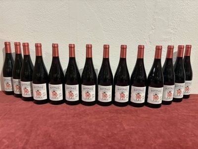 a group of bottles of wine sitting on top of a table