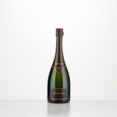 a bottle of champagne on a table with a white background