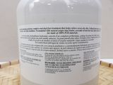 a close up of a bottle of lotion sitting on a table