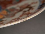 a close up of a plate with a brown and blue design on it