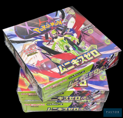 Deux boîtes de jeux de cartes Pokémon sont empilées l'une sur l'autre