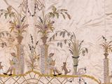 a very old embroidered wall hanging with a lot of flowers on it