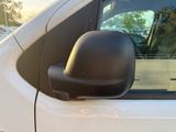 a close up of a side view mirror on a white car