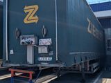 a large semi truck that is parked in a parking lot