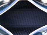 an image of a blue purse with a black background