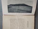 two pages of a book with a picture of a mountain