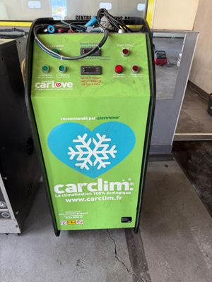 a green machine with a snowflake on the side of it