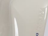 a close up of a white vase with blue writing on it