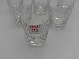 four glasses with numbers on them sitting on a table