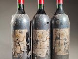three bottles of wine sitting next to each other on top of a table