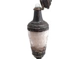 a small vase with a glass on top of it
