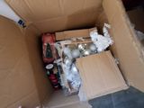 a cardboard box that has a bunch of items inside of it