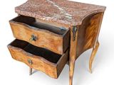a small wooden table with two drawers and a marble top