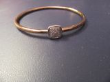an image of a gold ring with diamonds on it