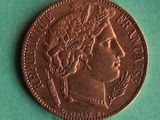 a close up of a coin on a green surface