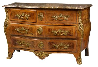 a wooden chest of drawers with a marble top