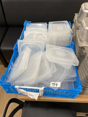 many containers of food sitting on a table in a store