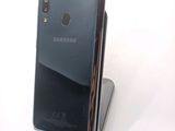 a close up of a cell phone on a stand