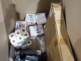 a cardboard box full of toilet paper and toilet paper rolls