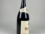 a bottle of wine that is sitting on a table
