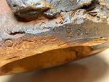 a close up of a piece of metal on a table
