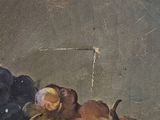 a painting of a bowl of grapes and grapes on a table