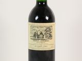 a bottle of wine that is sitting on a table
