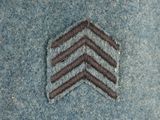 a picture of a close up of a chevroned pattern on a denim jacket